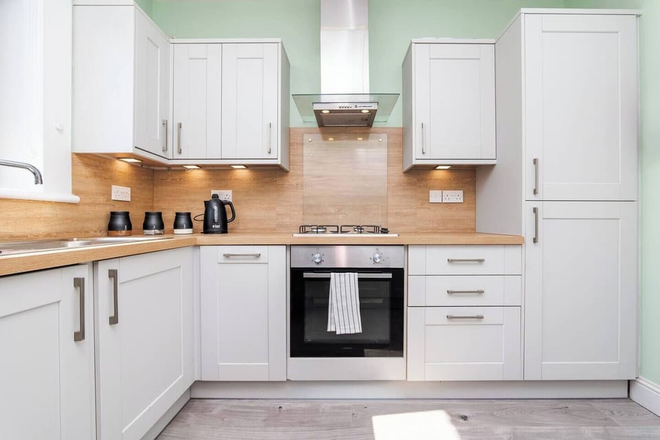 This well-equipped kitchen makes cooking easy and enjoyable. Clean, spacious, and thoughtfully arranged.