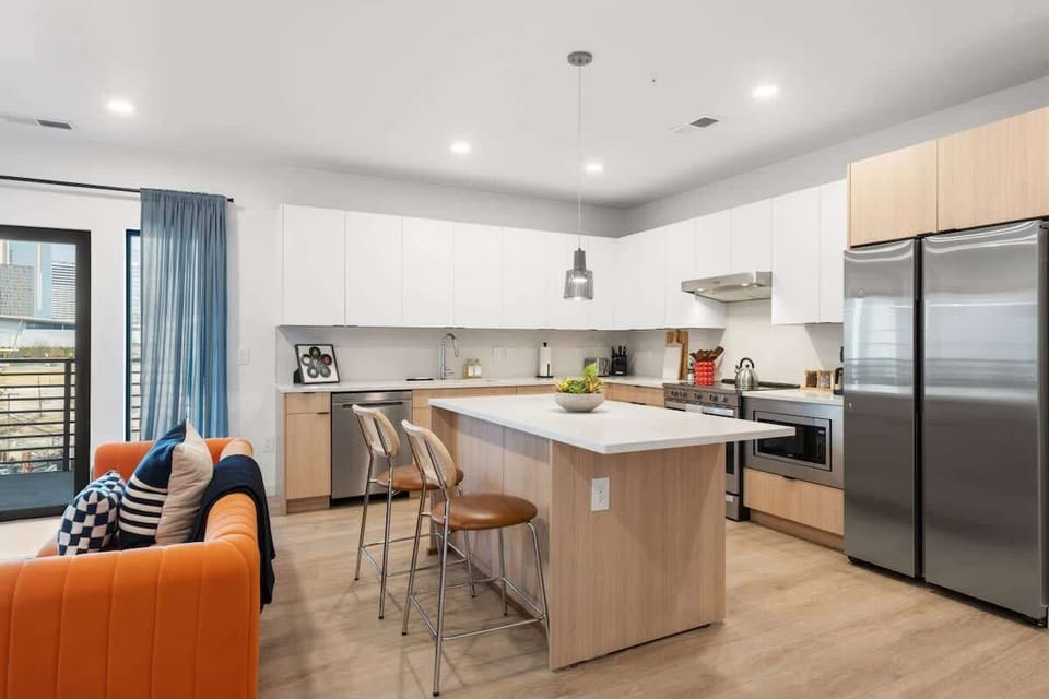 Open-concept kitchen with modern appliances and bar seating