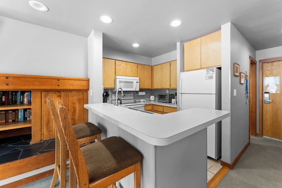Cook together in your fully equipped kitchen with modern appliances and comfortable breakfast bar seating.