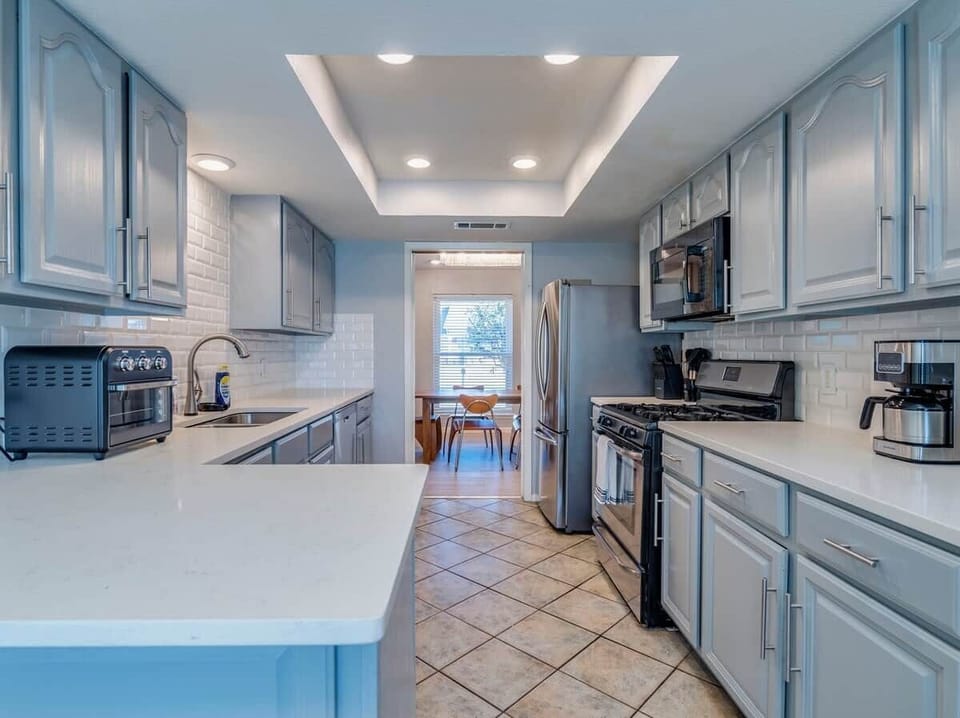 Kitchen has Dishwasher, Microwave, Refrigerator, Electric Stove, Oven, Dishware, Filter Coffee Maker. 