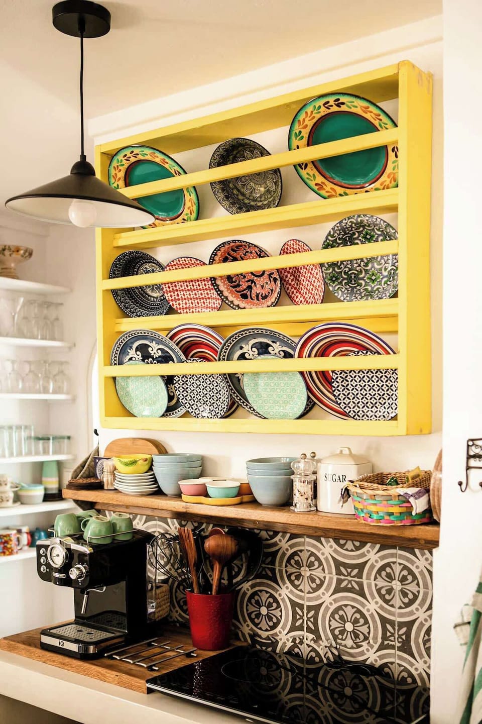 Stylish Kitchen Corner with Espresso Machine and Decorative Island Ceramics