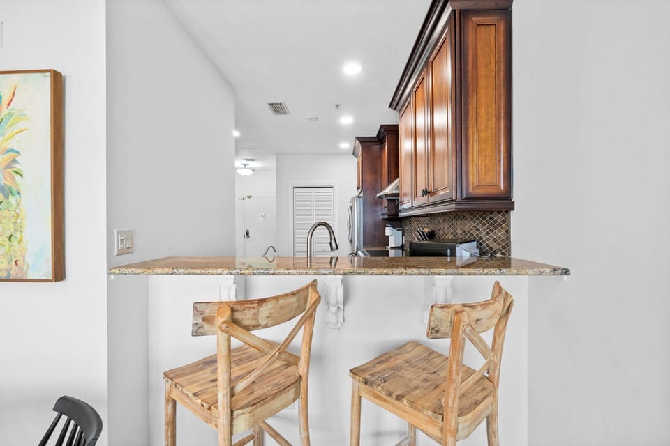 Modern kitchen with stainless steel appliances and a breakfast bar