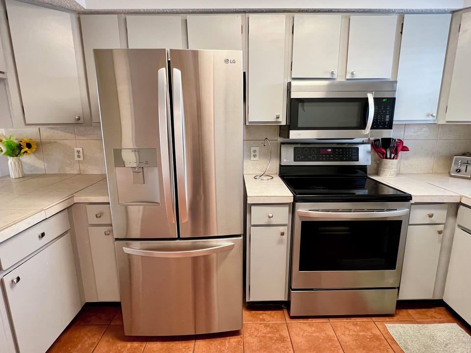 Modern kitchen with stainless steel appliances for easy meal prep