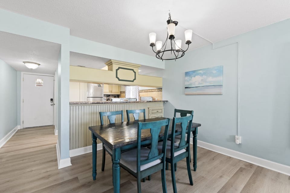 Enjoy meals with a view in this charming dining area, offering a coastal vibe.