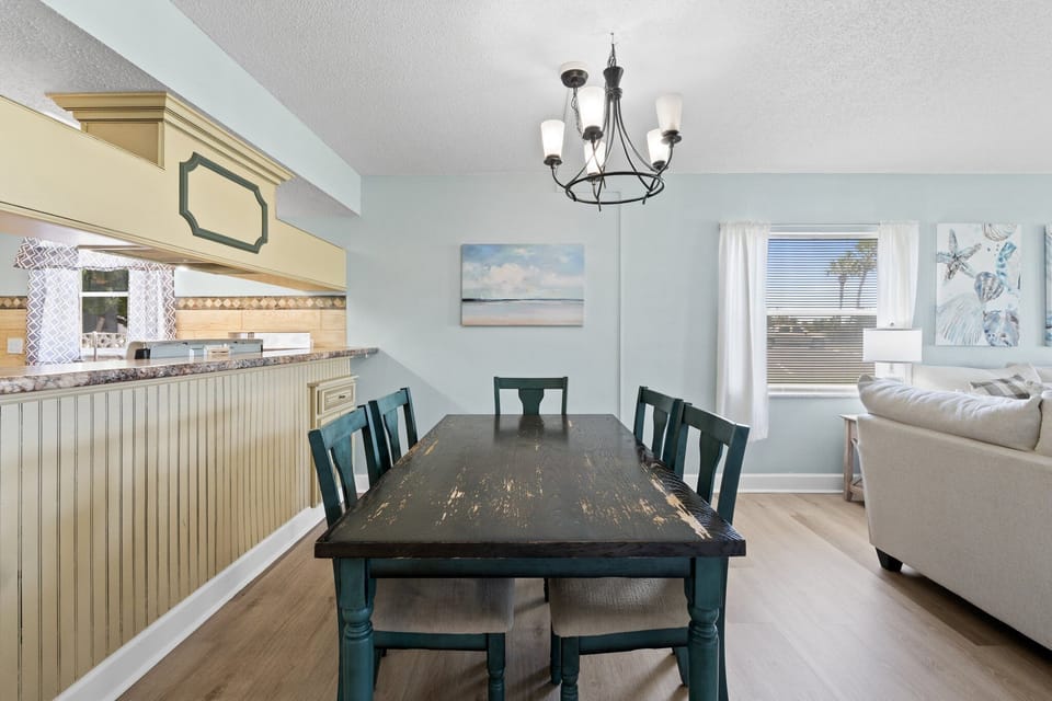 Enjoy meals with a view in this charming dining area, offering a coastal vibe.