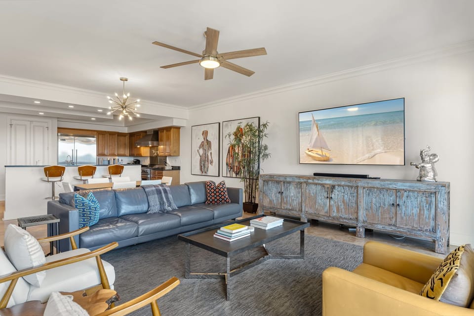 Sink into the plush leather sofa and enjoy your favorite movies on the large TV in this stylish living space.