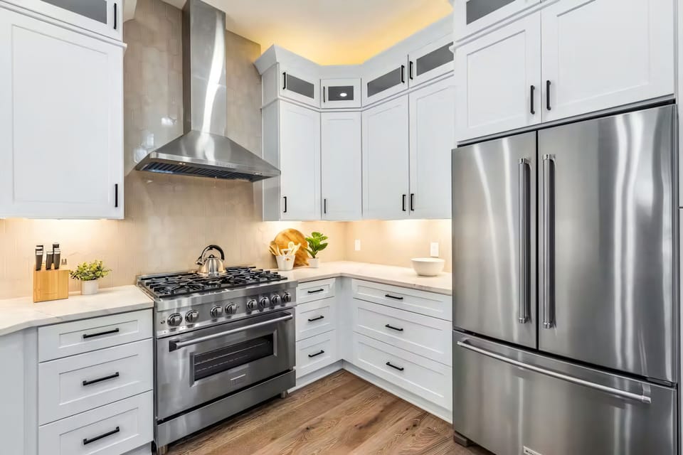 A refined chef’s space offering top-tier appliances, abundant storage, and clean, timeless finishes.