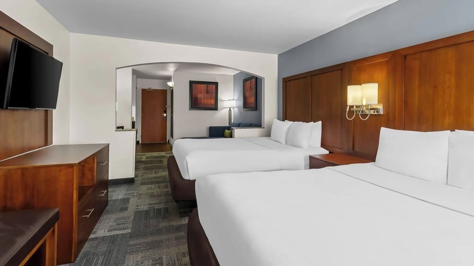 Drift off peacefully in a bright room with warm wood accents.