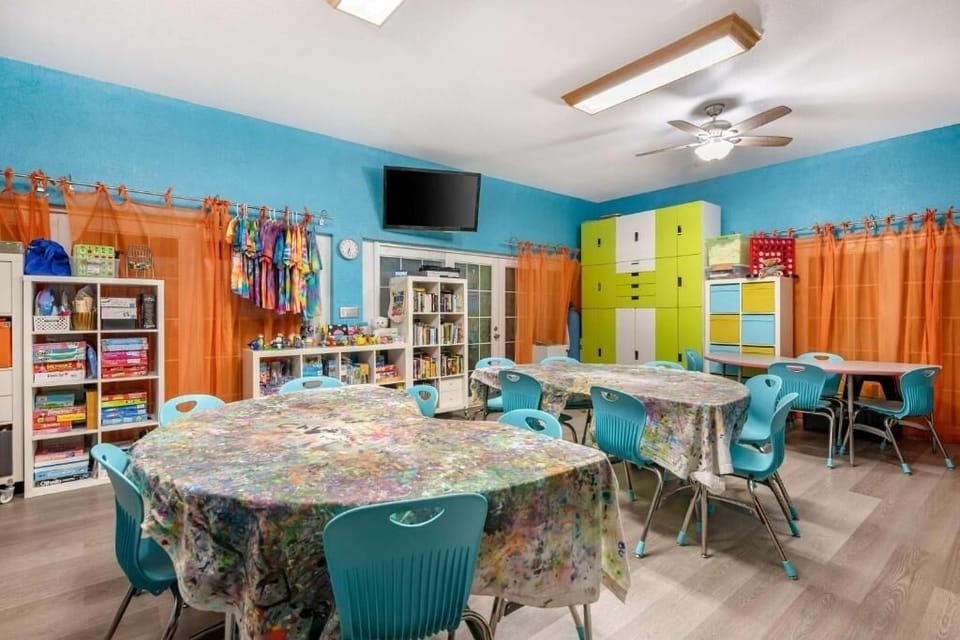 Create colorful crafts together in this cheerful activity room.