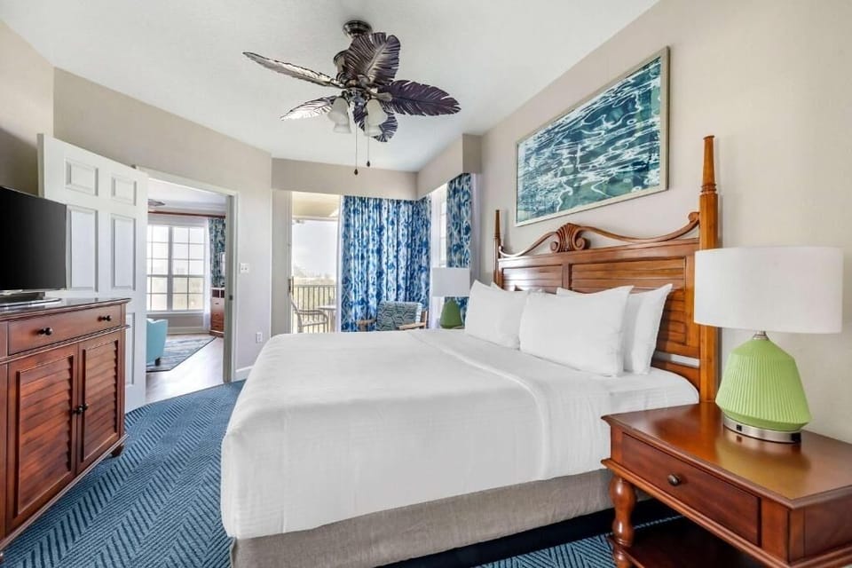 Unwind in crisp linens and coastal style after beach days.