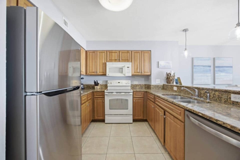 Fully equipped kitchen with stainless steel appliances and ample counter space