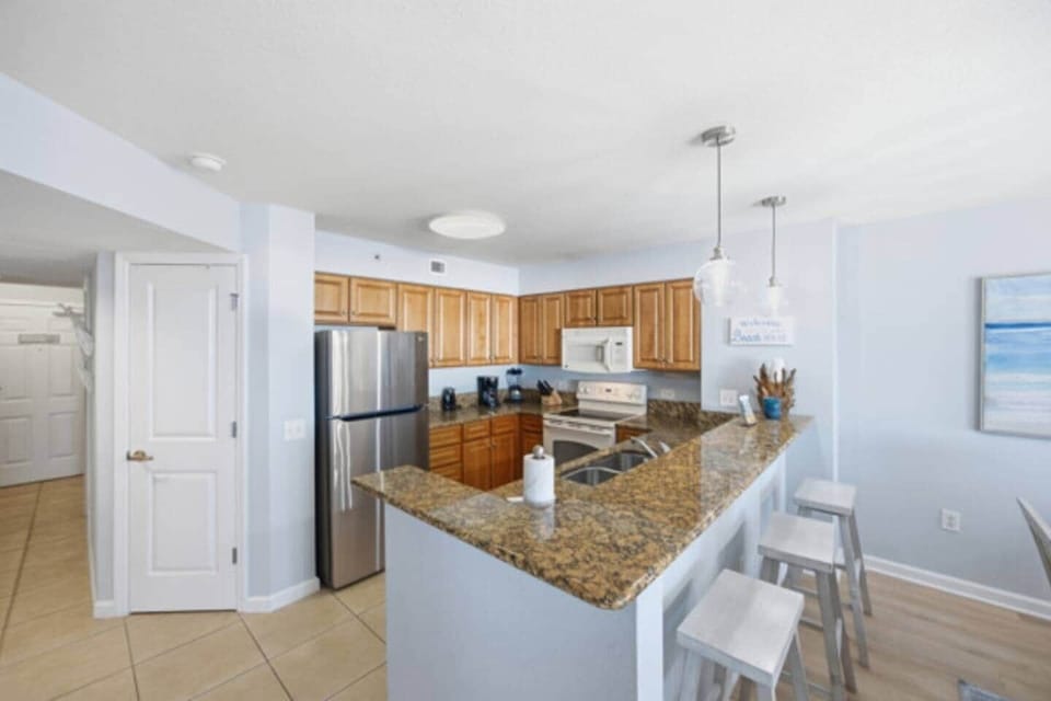 Open-concept kitchen with breakfast bar seating