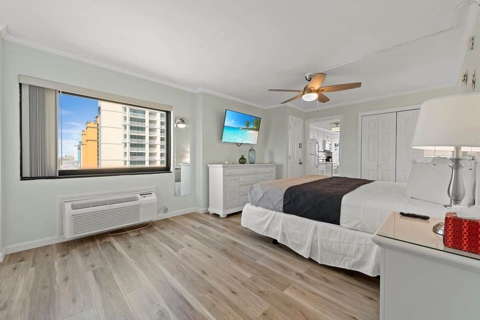 Spacious, serene bedroom retreat with coastal tones, plush bedding, and modern comforts — the perfect place to unwind after a day at the beach. ✨