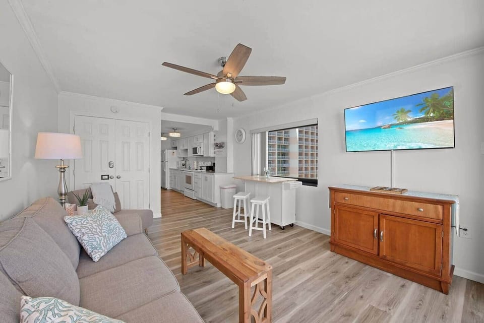 Watch tv on the smart tv or just take in all that's happening on the street view out the window. The open concept kitchen allows you to visit w/ everyone in your group while you may be preparing a snack. 