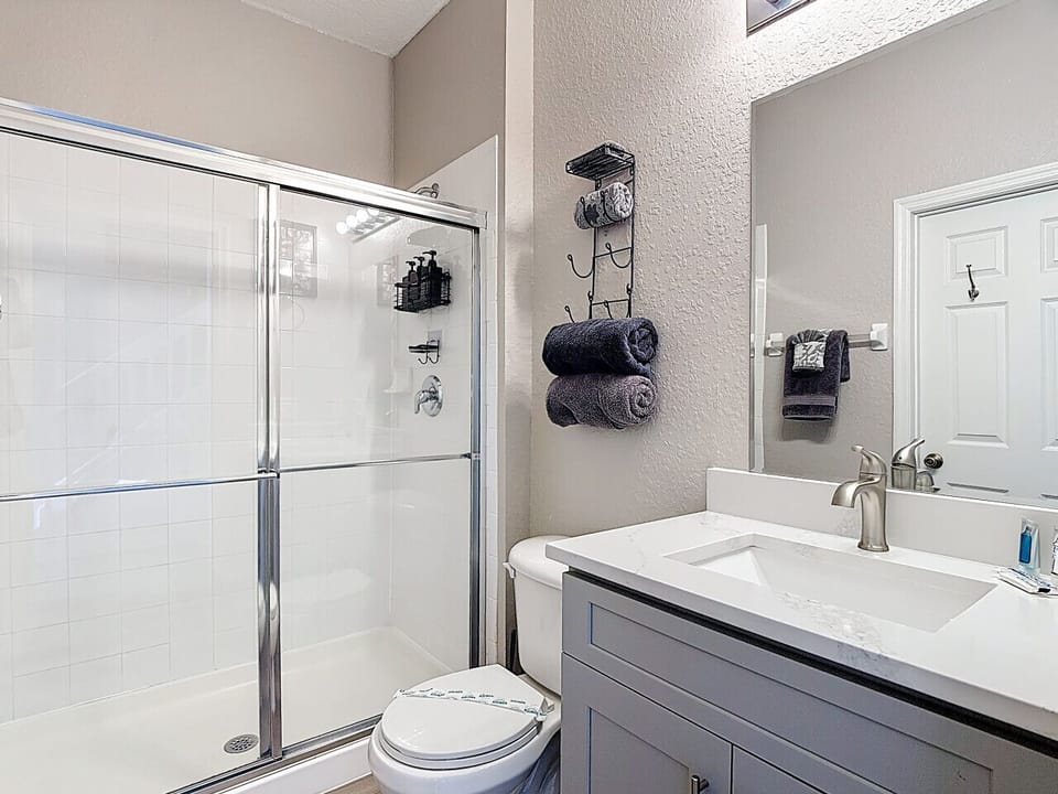 Modern bathroom with walk-in shower and vanity