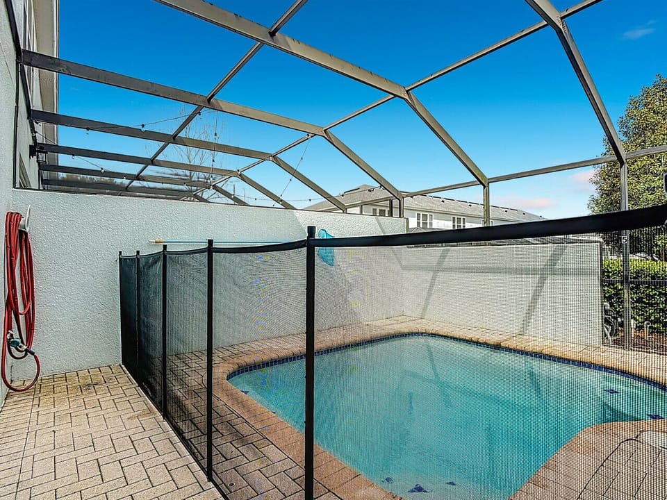 Fully enclosed pool with safety barrier