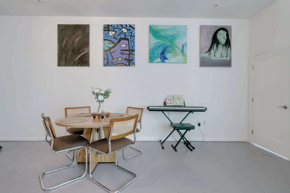 Enjoy a sophisticated setting with a piano right at the heart of the home’s social space