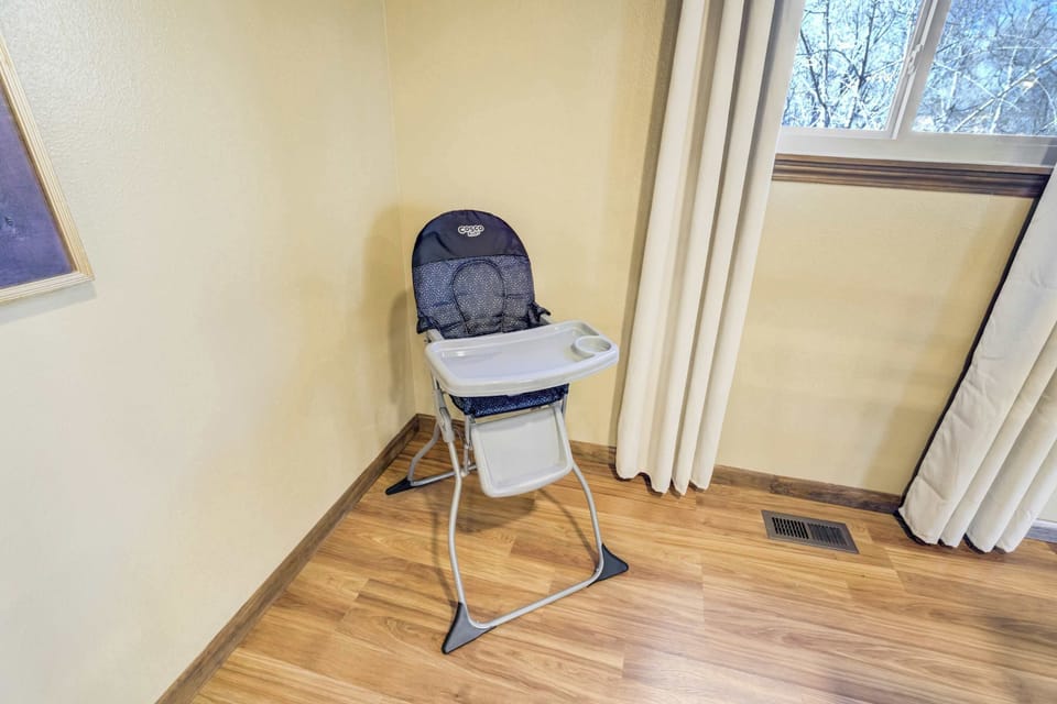 For guests traveling with small children, a high chair is tucked into a dedicated corner of the dining area. This thoughtful addition ensures that even the youngest travelers have a comfortable spot during family meal times.