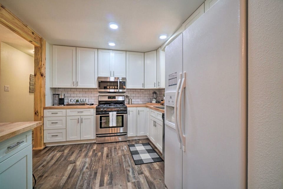Kitchen | Stainless Appliances | White Cabinets & Butcher Block Island