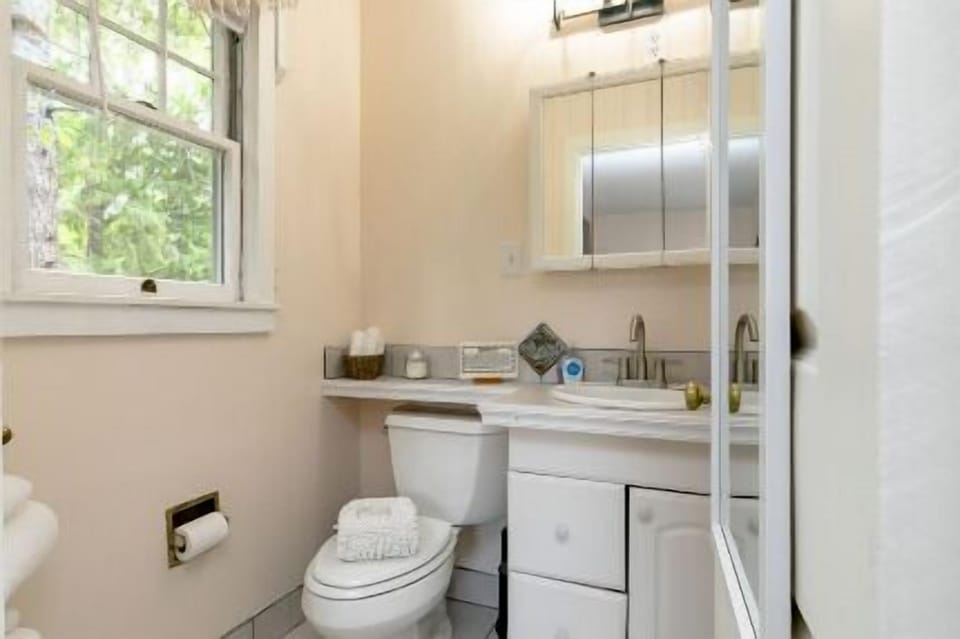 Spacious bathroom with whirlpool hot tub. 