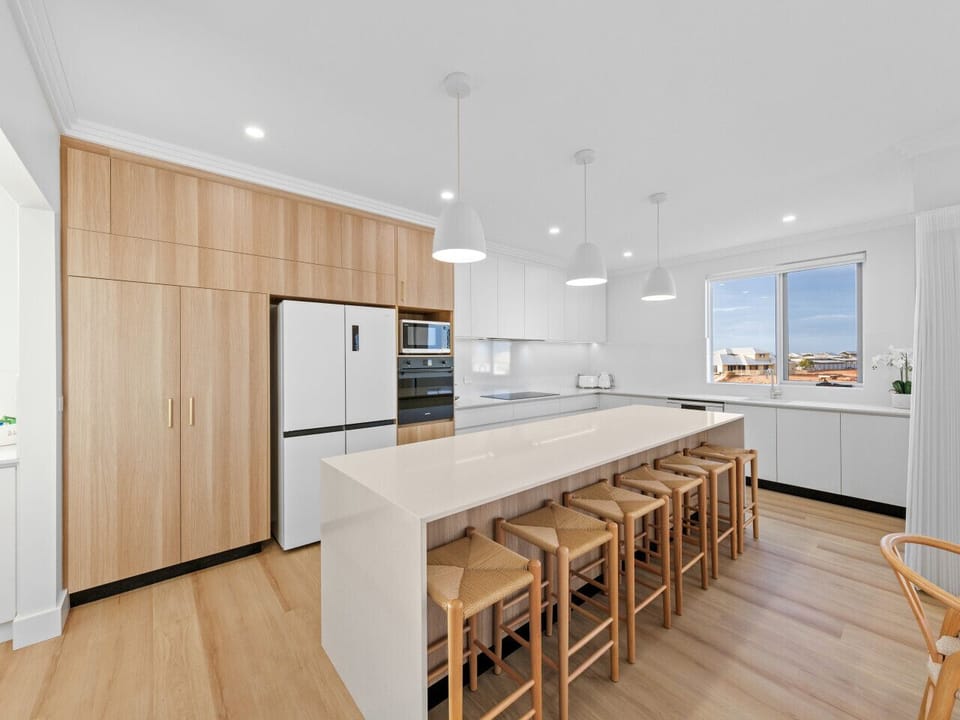 Spacious and fully equipped kitchen with quality appliances and plenty of bench space for prepping fresh seafood or family meals.