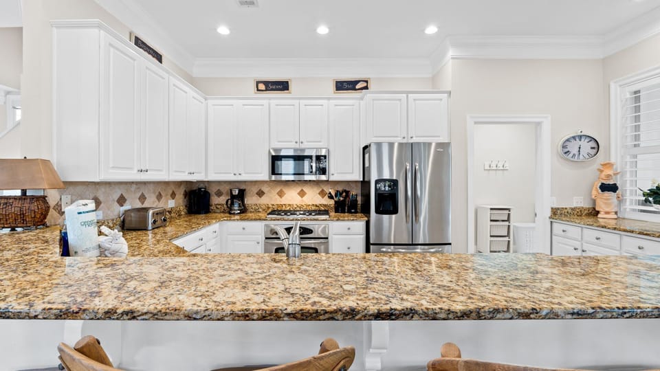 Great open kitchen with plenty of prep & storage space - well-equipped too!