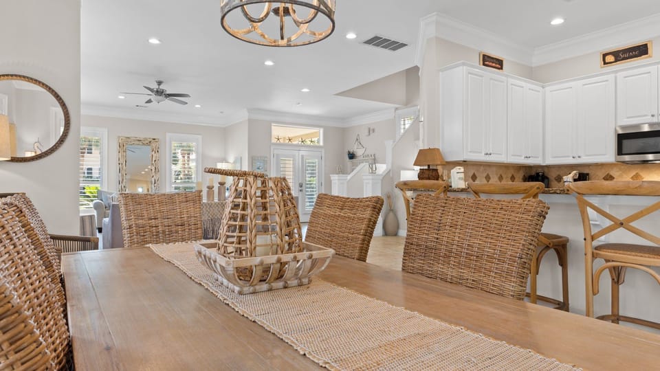 Stylish dining area overlooking the kitchen and living room, ideal for family meals and gathering together.