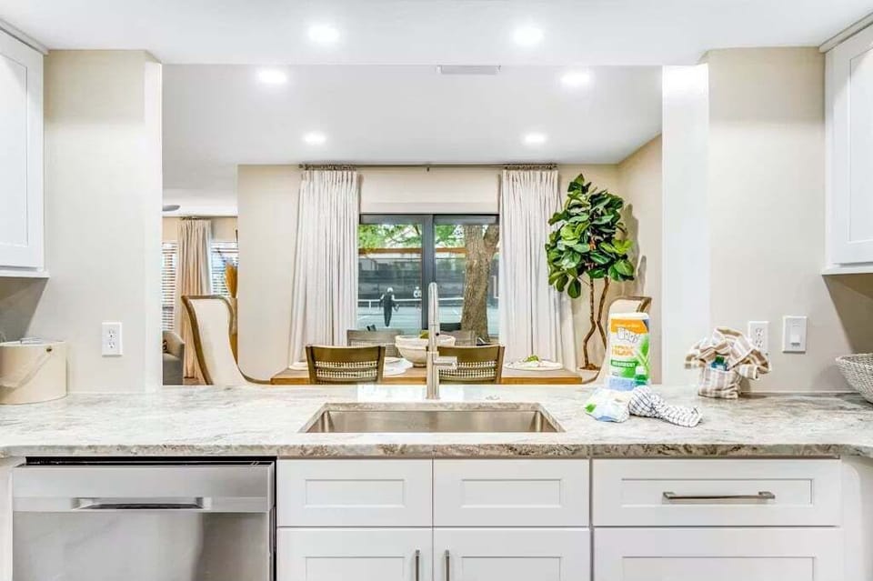 View of the dining room from the kitchen. Great open space for having conversations while preparing a scrumptious meal.