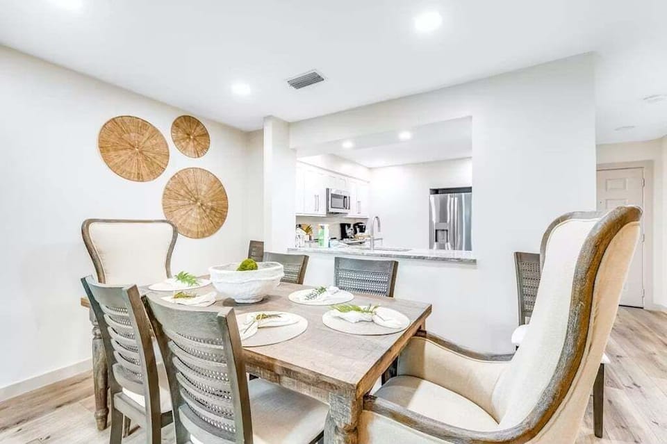 Dining table 6 with two additional chairs for larger parties.