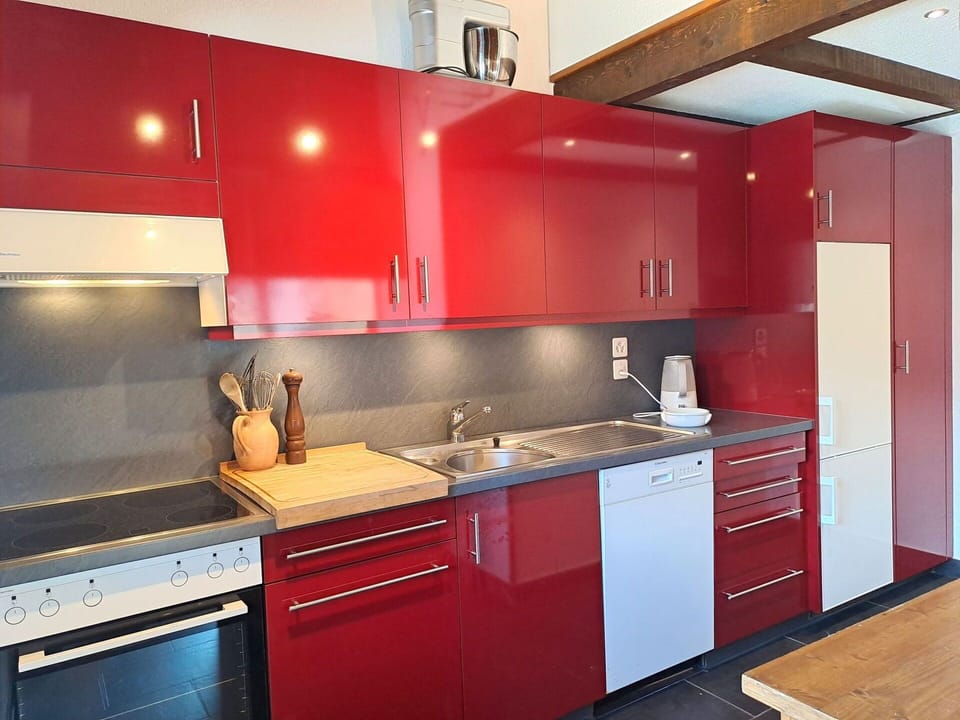 Kitchen, Kitchen Appliance, Cabinetry, Red, Countertop, Flooring, Major Appliance, Interior Design, Sink, Furniture