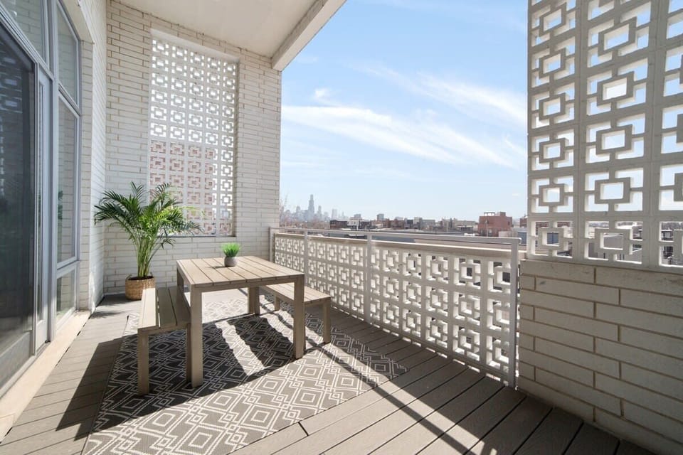 Shaded balcony nook w/ patterned screen & fresh outdoor breeze