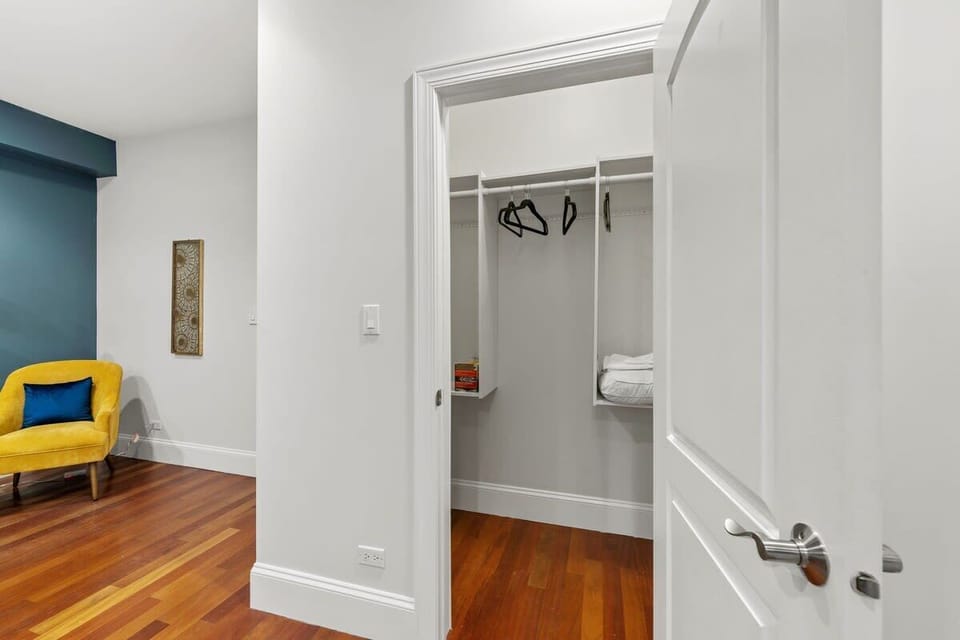 Walk-in closet w/ hanging space, shelving, & easy access from the bedroom.