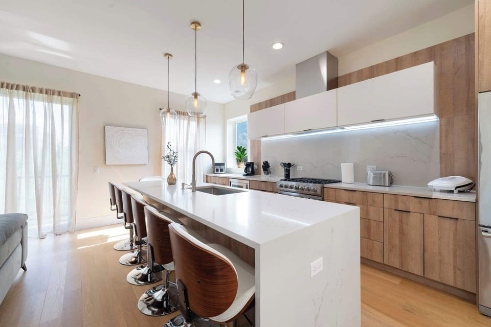 Bright kitchen workspace w/ generous counters that make everyday cooking feel effortless.