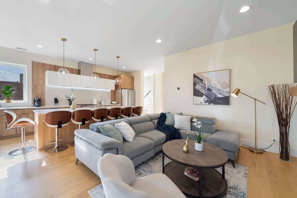 Open living area w/ comfy seating, clean lines, & an easy flow for relaxing or gathering together.