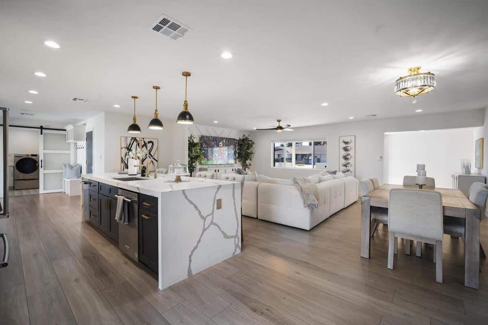 Fully equipped kitchen with stainless steal appliances and a kitchen island with bar seating for 4 guests.