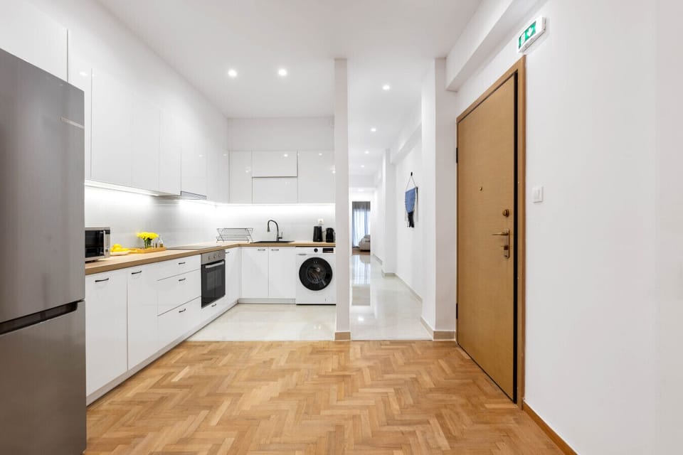 Modern kitchen with full appliances and ample storage.