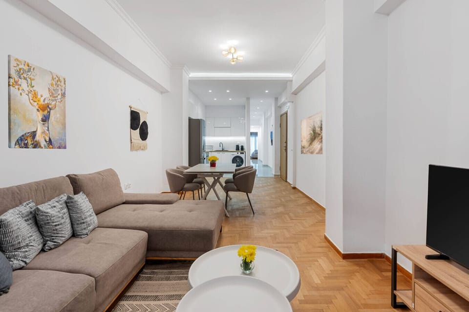 Bright living and dining area with modern furnishings.