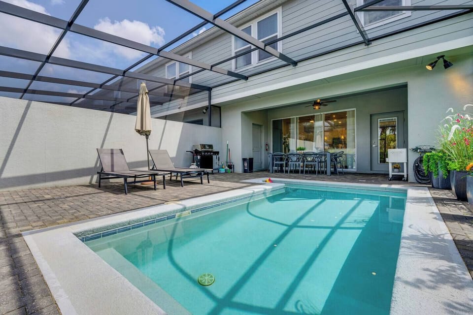 Big pool with outdoor seating / dining spaces