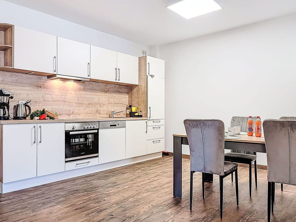 Furniture, Wood, Flooring, Interior Design, Wood Flooring, Room, Floor, Cabinetry, Apartment, Laminate Flooring