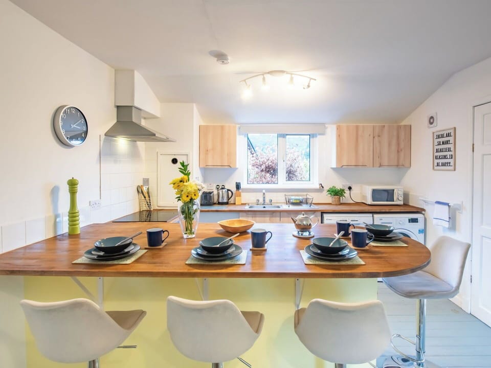 Furniture, Interior Design, Countertop, Kitchen, Flooring, Kitchen Appliance, Wood, Ceiling, Chair, Kitchen & Dining Room Table