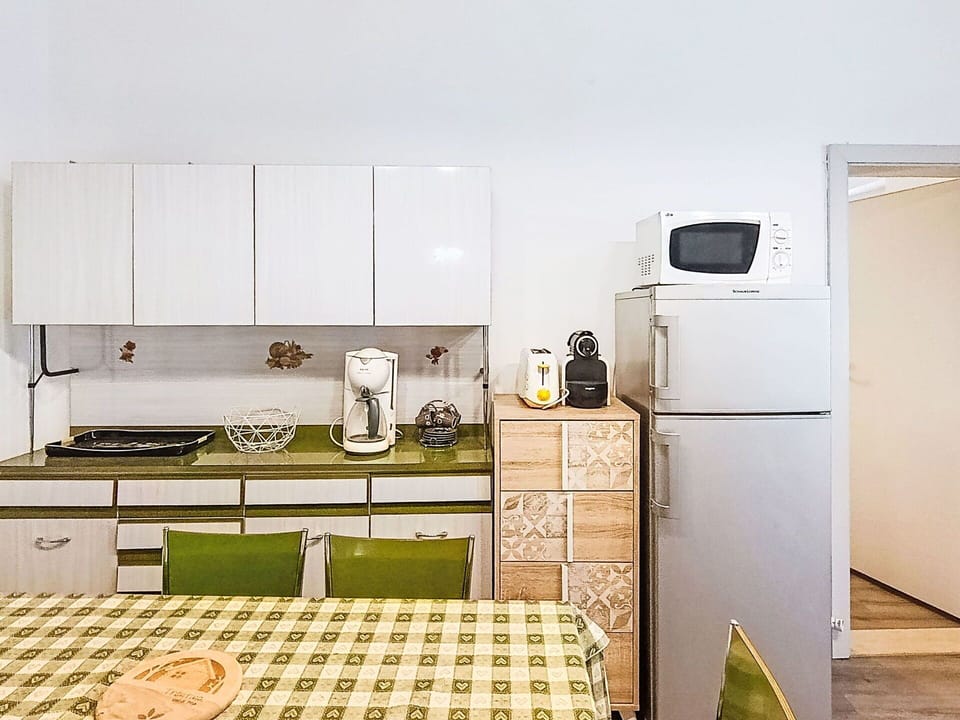 Furniture, Interior Design, Kitchen Appliance, Major Appliance, Flooring, Kitchen, Wood, Cabinetry, Floor, Room