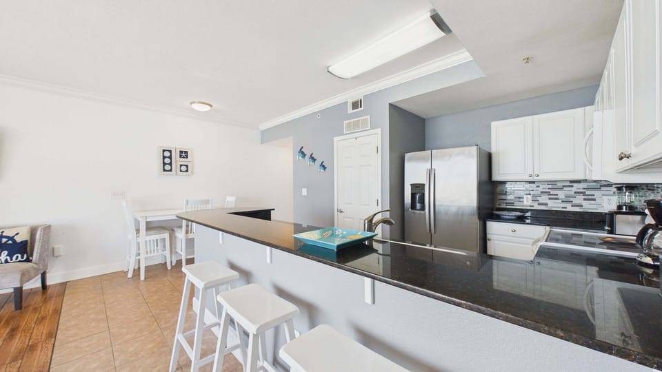 Kitchen has breakfast bar seating