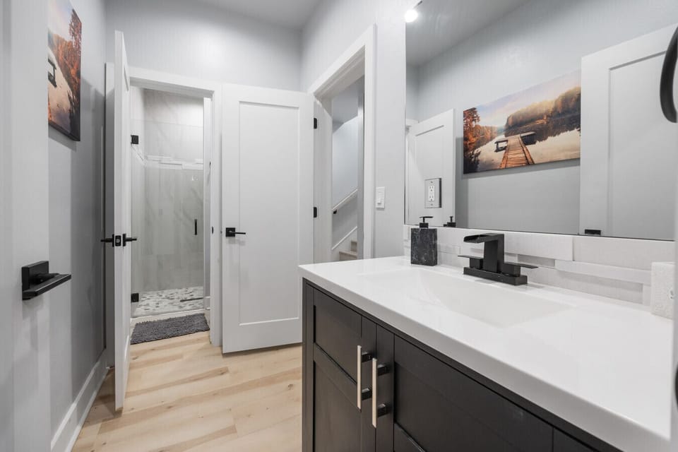 Lower-level full bathroom with shower.  Located just outside of the bunk bedroom
