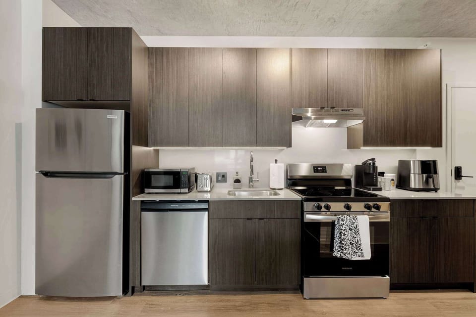 Clean, modern kitchen w/ sleek cabinetry and generous counter space for easy everyday cooking.