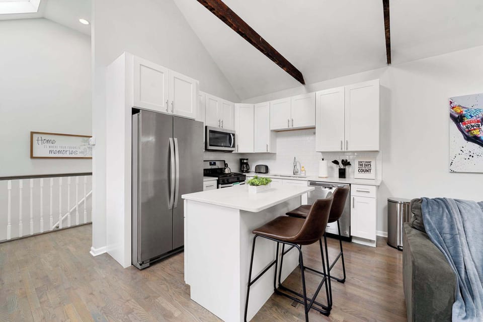 Sleek kitchen view w/ a streamlined setup for stress-free cooking.