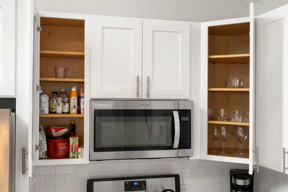 Built-in microwave & cabinetry designed for convenience & a tidy look.