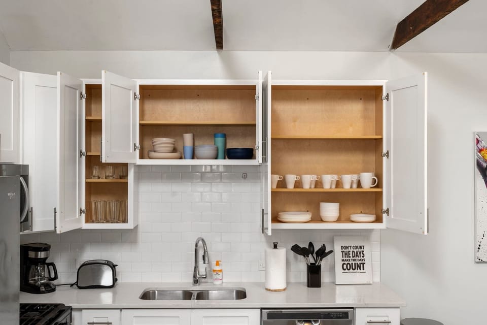 Organized cabinet storage that keeps cookware neatly within reach.