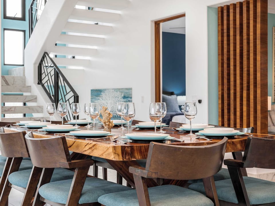 Dining area set for larger groups, blending seamlessly with the kitchen for easy hosting.