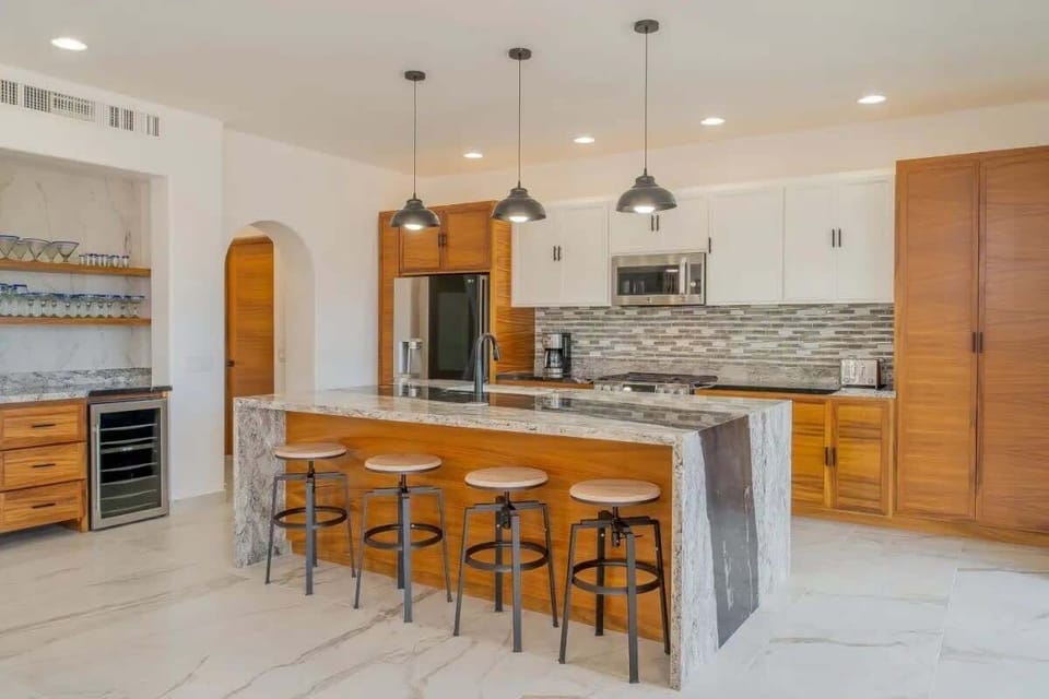 Fully stocked chef-style kitchen w/ generous counter space, modern appliances, and room to cook together with ease.