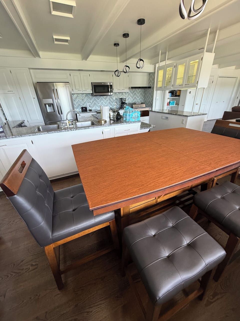 Updated kitchen nook area with table and 8 stools